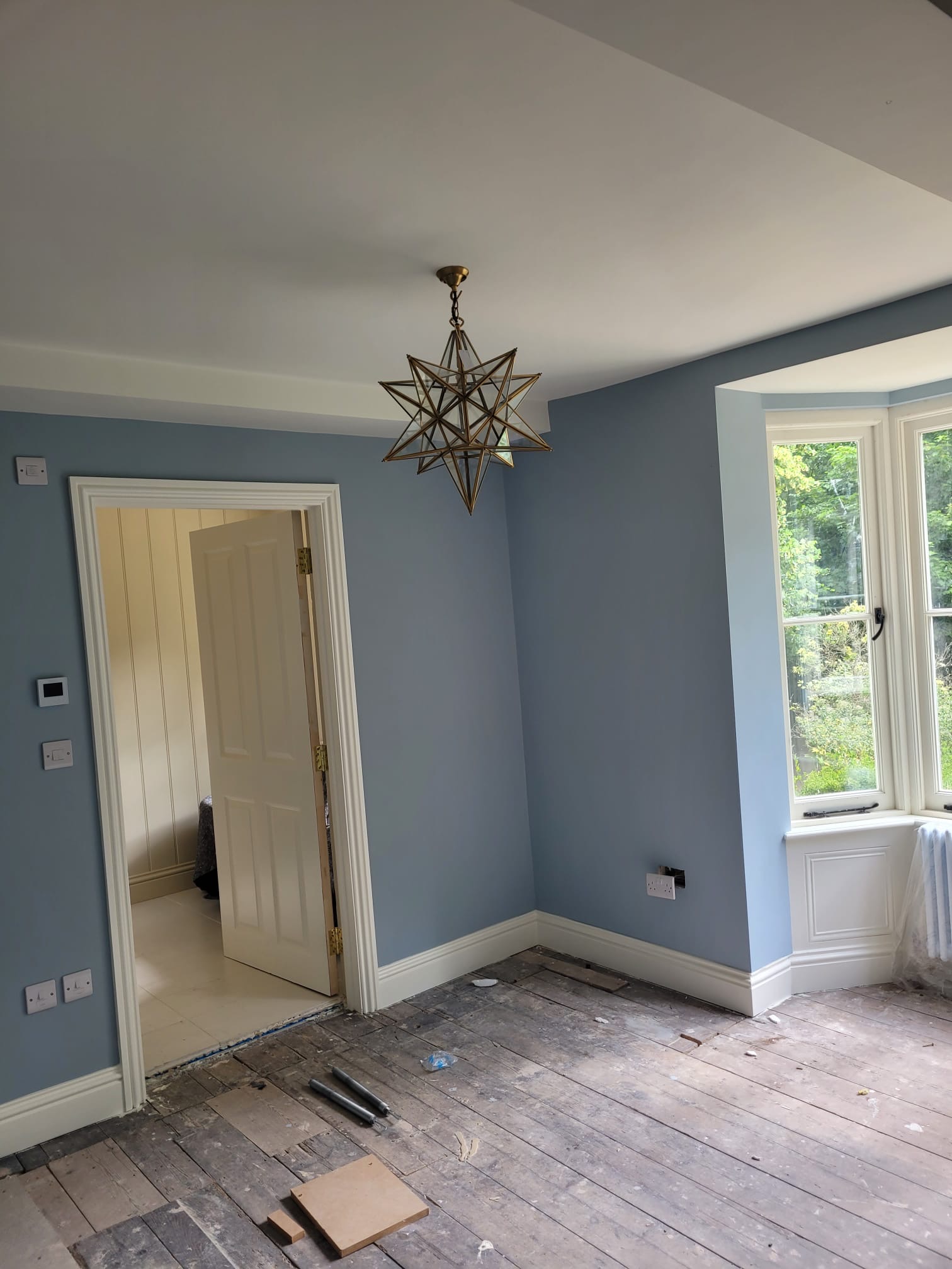 Period room with blue walls by DecorInnovations