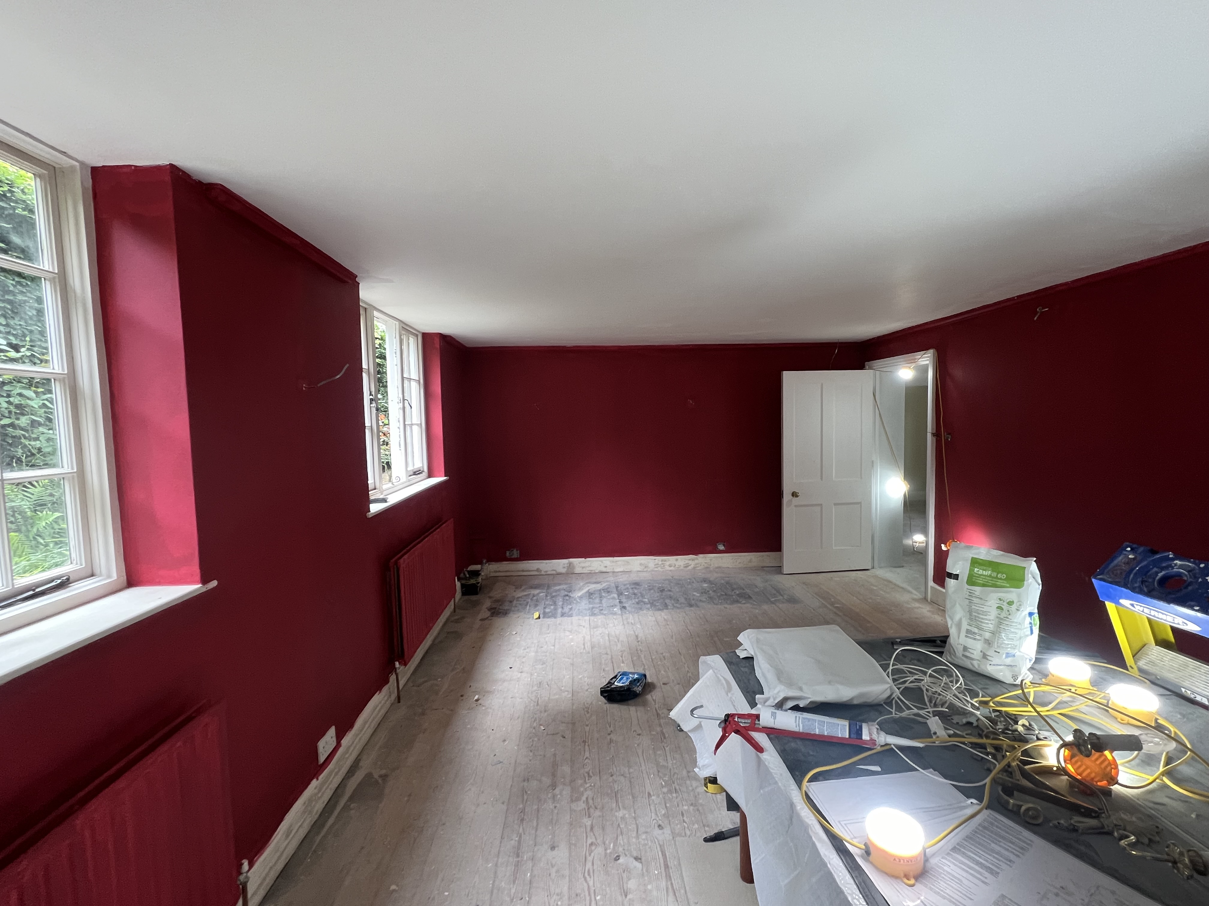 Burgundy painted room by DecorInnovations